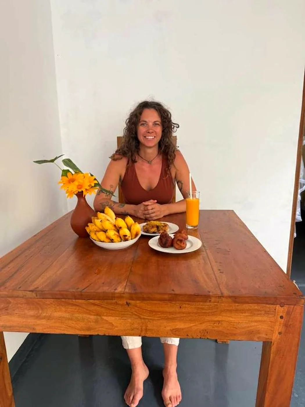 A guest relaxing at a private terrace table