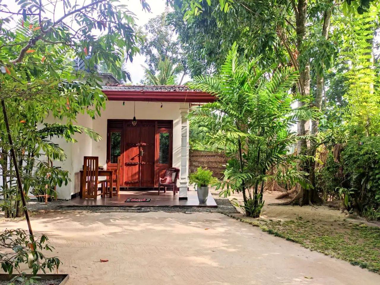 The garden and verandah of AURORA Midigama in Ahangama, Sri Lanka